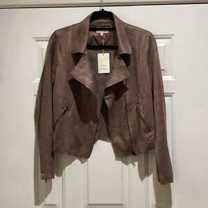 Skies are blue tan texture jacket